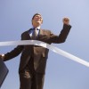 Businessman Crossing the Finish Line Businessman Crossing the Finish Line